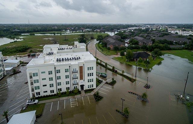 streets flooded around a building