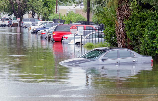 cars in flooded parking lot
