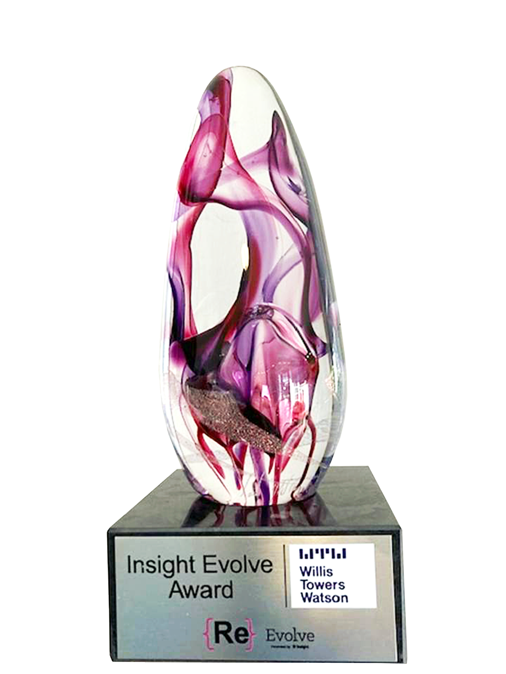 pink crystal trophy with the words Insight Evolve Award.